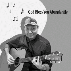 a man playing a guitar with the words god bless you abundantly