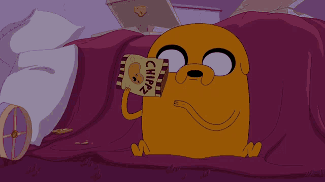 a cartoon dog is holding a bag of chips