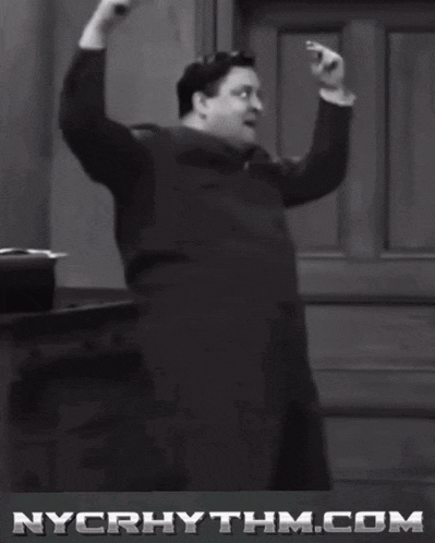 a black and white photo of a man with nycrhythm.com in the corner