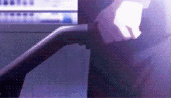 a person is walking down a treadmill in front of a computer monitor .