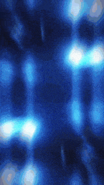 a dark blue background with a lot of light coming out of it