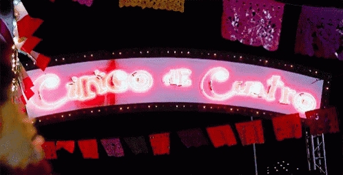 a neon sign that says cinco de cuatro