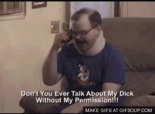 a man is sitting on a couch talking on a cell phone .