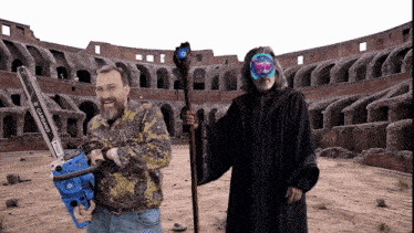 a man holding a chainsaw stands next to a man holding a wand
