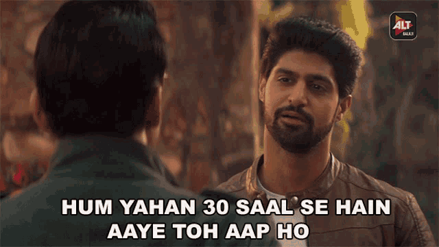 a man talking to another man with the words hum yahan 30 saal se hain aaye toh aap ho below him