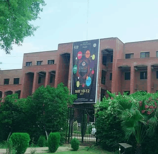 a large billboard on the side of a brick building advertises ice