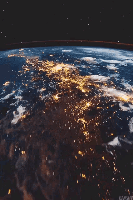 an aerial view of the earth at night with the words banshy on the bottom