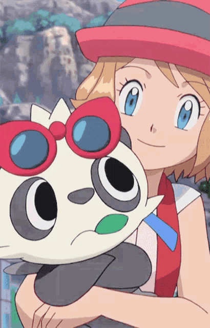 a girl in a red and white hat is holding a stuffed animal