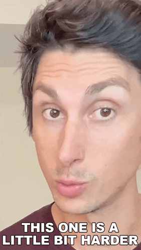 a close up of a man 's face with a caption that says `` this one is a little bit harder ''
