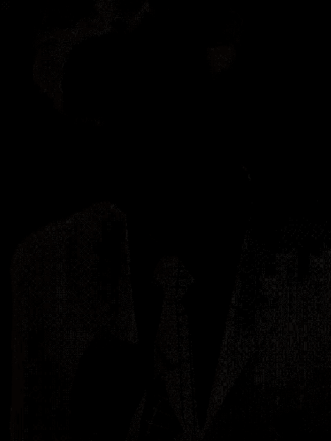 a black and white photo of a man 's face with a white background