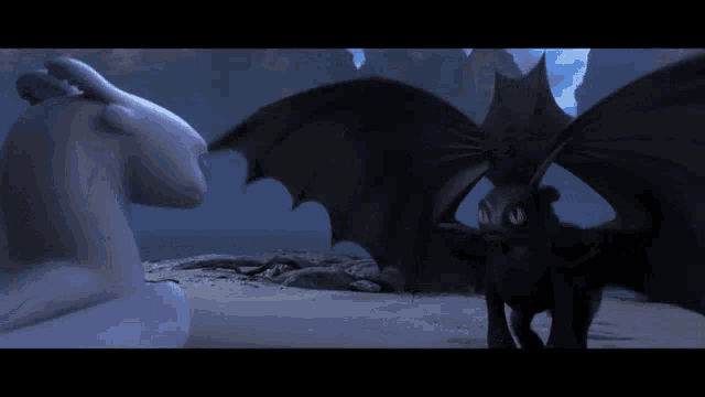 a couple of dragons standing next to each other