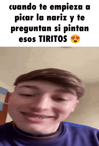 a young man with a blue shirt is smiling with a smiley face in the corner