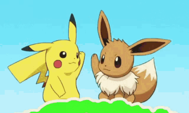 a pikachu and an eevee are standing next to each other on a green hill .