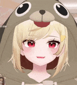 a close up of a girl wearing a bear hoodie