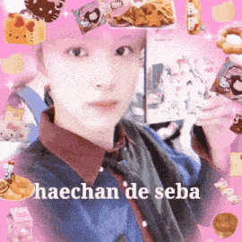 a boy with pink hair is taking a selfie with a pink background and the words haechan de seba on the bottom