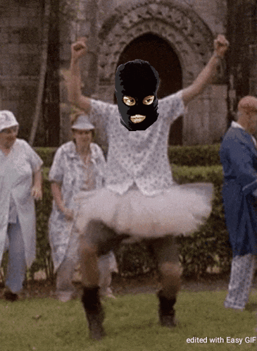 a man wearing a balaclava and a tutu is dancing