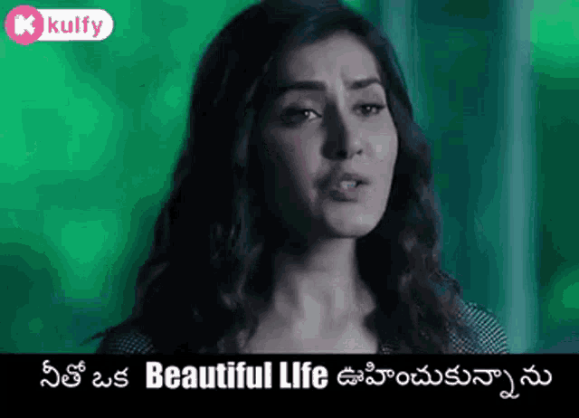 a woman is standing in front of a green background with the words `` beautiful life '' written in a foreign language .