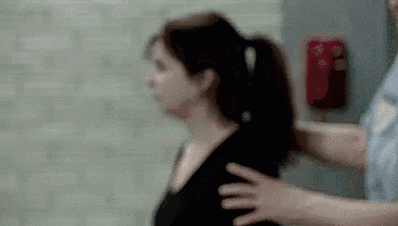 a blurry picture of a man putting his hand on a woman 's back .