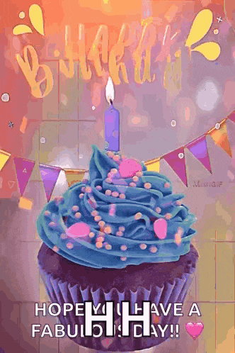 a cupcake with blue frosting and a candle on it
