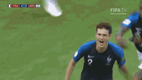 a soccer player with the number 2 on his jersey is running on the field .