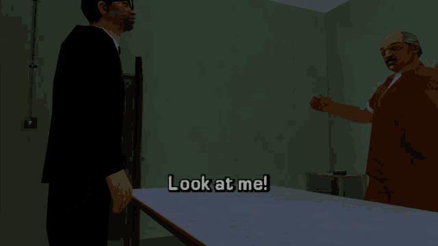 a man in a suit stands next to a man in a jail uniform and says " look at me "
