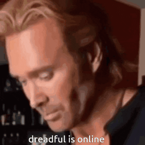 a close up of a man 's face with the words dreadful is online below him