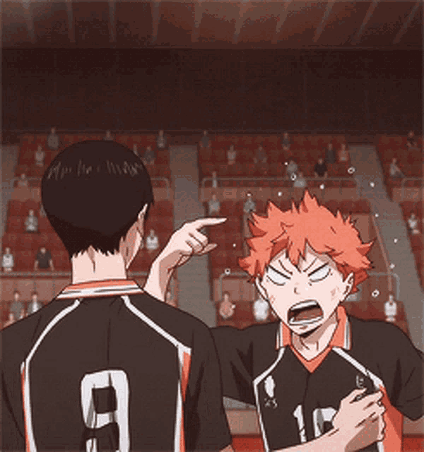 a man with the number 10 on his shirt is pointing