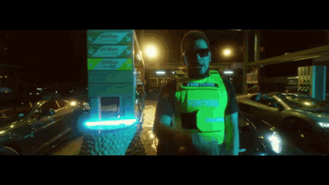 a man wearing a yellow vest that says victoria police