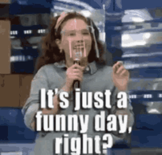 a girl is holding a microphone and saying `` it 's just a funny day right ? ''