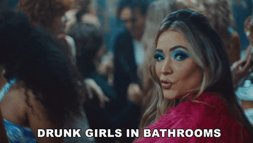 a woman in a pink dress with the words drunk girls in bathrooms written below her