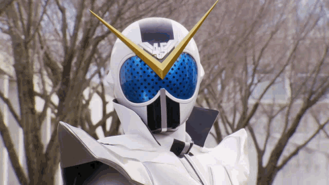 a person wearing a white and blue helmet with a yellow arrow pointing to the left