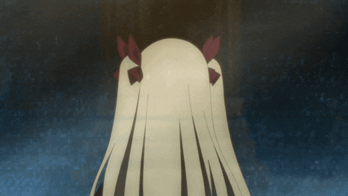 a close up of a girl 's head with red bows