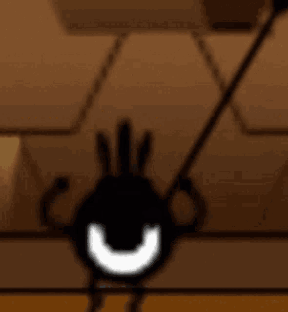 a cartoon character is hanging from a rope with a smiley face on it .