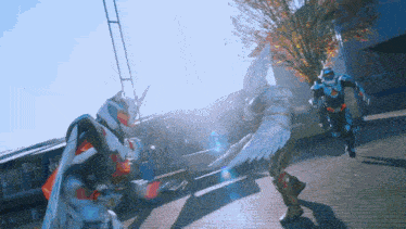 a man in a costume with wings is fighting another man in a costume with horns
