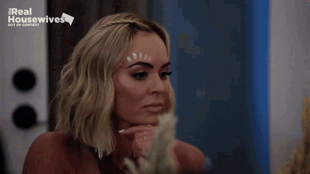 a woman in a very revealing dress is featured on the real housewives show