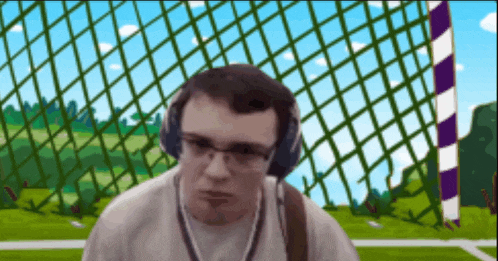 a man wearing headphones and glasses looks at the camera
