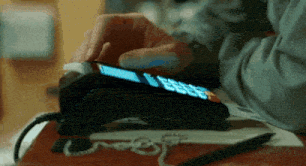 a person is using a credit card machine to pay for something
