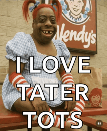 a wendy 's sign is behind a woman in a wendy 's outfit