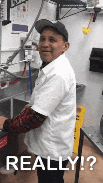 a man standing in front of a sink with the word really on the bottom right