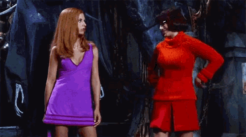 scooby doo and velma from scooby doo are hugging each other in a scene from the movie .