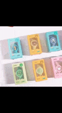 a bunch of different colored watches on a shelf