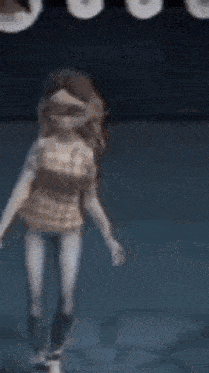 a cartoon character is dancing on a stage in a blue room .