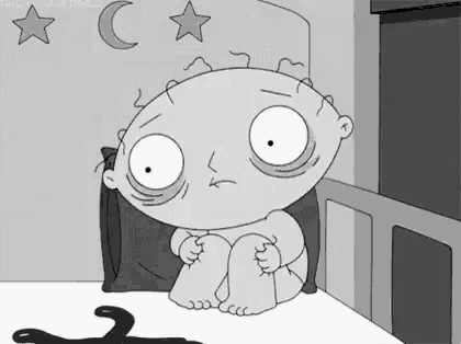 a black and white cartoon of a baby sitting on a bed with a cat .