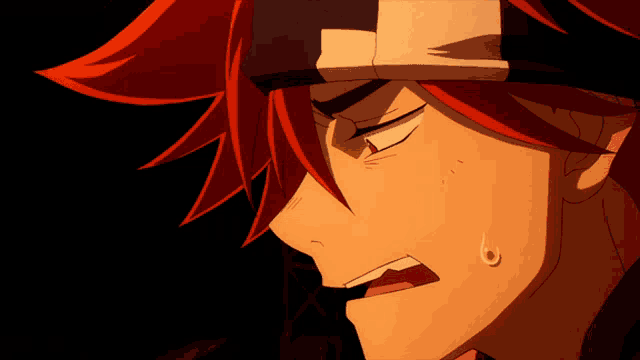 a close up of a man 's face with red hair