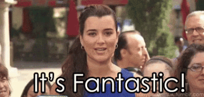 a woman is standing in front of a crowd and says it 's fantastic