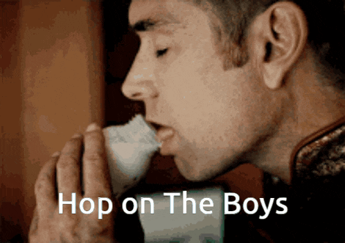 a man drinking from a cup with the words hop on the boys written on the bottom