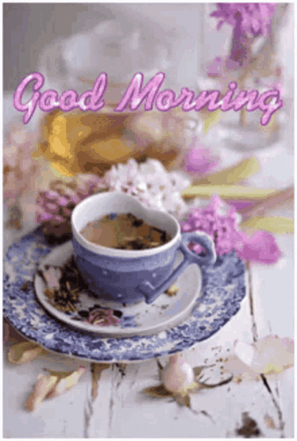 a cup of tea on a saucer with the words good morning written on the bottom
