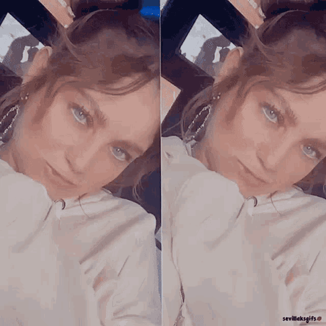 a woman with blue eyes is taking a selfie in front of a screen that says sevilleksgifs