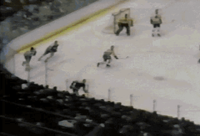 a hockey game is being played on the ice