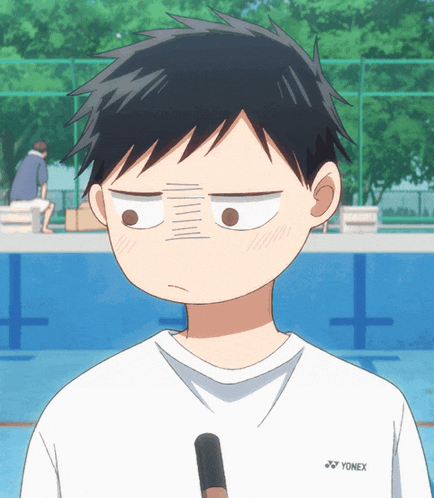 a boy wearing a white shirt with yonex on the back